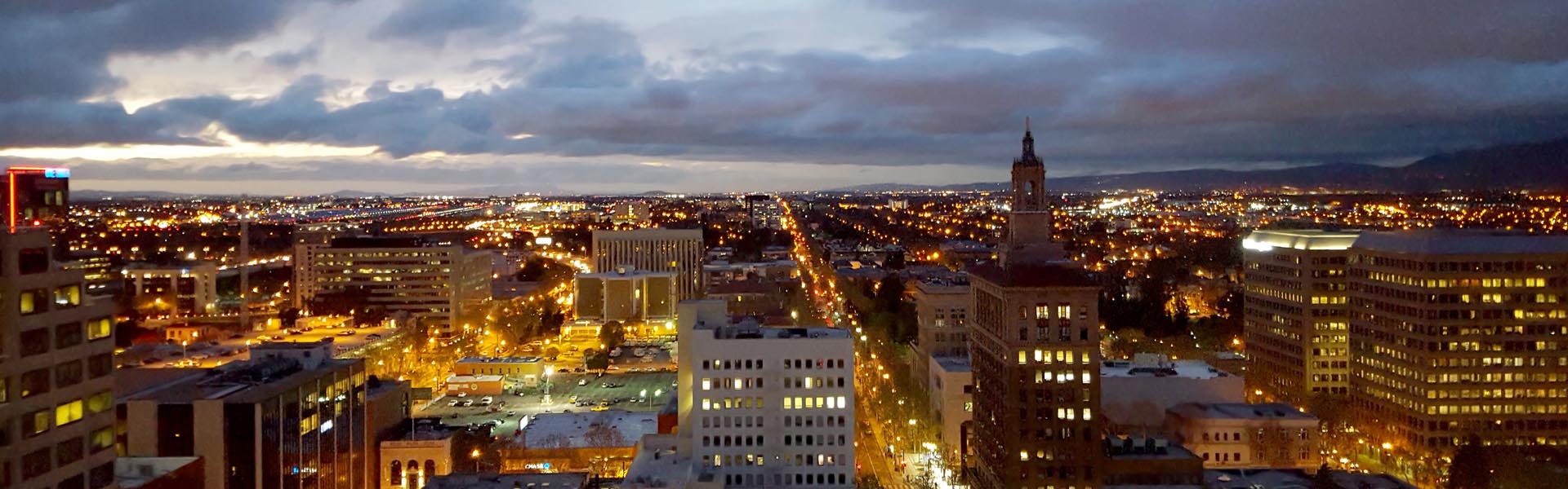 Neon color image of a band playing and people singing along
